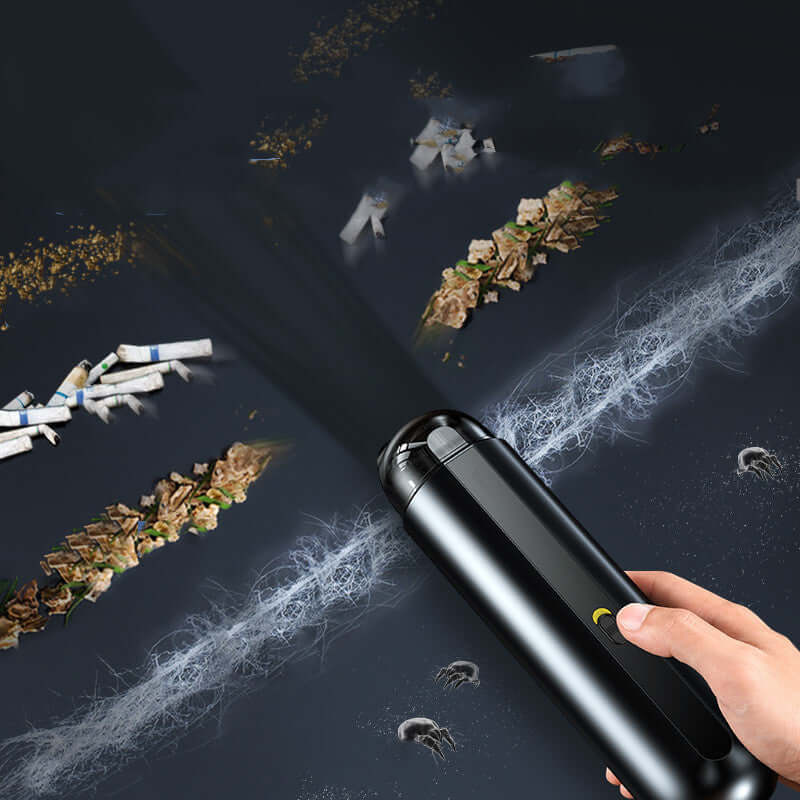 Portable wireless car vacuum cleaner in action, cleaning debris and dust from surfaces.